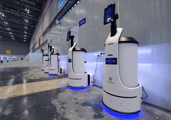 (220409) -- SHANGHAI, April 9, 2022 -- Robots are in service at a makeshift hospital converted from the National Exhibition and Convention Center (Shanghai) in east China s Shanghai, April 9, 2022. ) Xinhua Headlines: Shanghai s largest makeshift hospital for COVID-19 put into use LixHe 