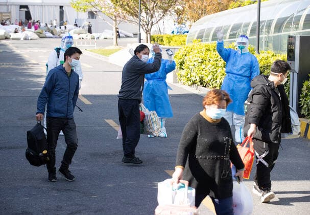 (220409) -- SHANGHAI, April 9, 2022 -- Patients who have recovered from COVID-19 leave a makeshift hospital converted from Shanghai Convention & Exhibition Center of International Sourcing in Shanghai, east China, April 9, 2022. The first group of 16 recovered COVID-19 patients left the makeshift hospital on Saturday. ) CHINA-SHANGHAI-PATIENTS-COVID-19-RECOVERY (CN) JinxLiwang 