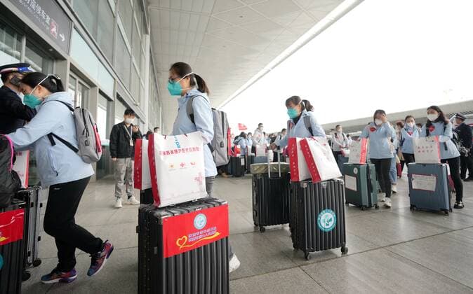 (220415) -- XI AN, April 15, 2022 -- Medics arrive at Xi an North Railway Station in Xi an, northwest China s Shaanxi Province, April 15, 2022. A team of 1,591 medics departed from Shaanxi on Friday to aid the battle against resurging COVID-19 pandemic in Shanghai. ) CHINA-SHAANXI-XI AN-MEDICS-SHANGHAI-AID (CN) LixYibo 