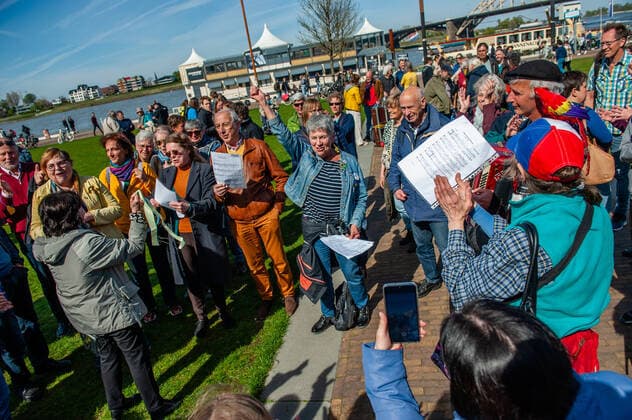 April 16, 2022, Nijmegen, Gelderland, Netherlands: A group of musicians seen singing the Ukrainian national anthem after the concert. Under the motto, music connects people , the Nijmegen musician Mart Heijmans brought together 400 musicians at the Waalkade to sing the Ukrainian national anthem and other songs to show their solidarity with Ukraine. Around 250 of them were Ukrainian refugees received during the last months in the city. Four Ukrainian singers who have fled, including an opera singer, performed a few more songs before an attentive and emotional crowd. Nijmegen Netherlands - ZUMAs197 20220416_zaa_s197_066 Copyright: xAnaxFernandezx