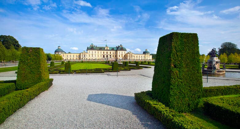 Drottningholm castle , 12583988.jpg, stockholm, sweden, drottningholm palace, castle, swedish culture, palace, nobility, nordic countries, famous place, large, formal garden, ornamental garden, history, travel destinations, park, building exterior, garden path, royal castle, built structure, outdoors, horizontal, facade, yellow, travel, tourism, european culture, europe, classical style, residential structure, majestic, statue, blue, sky, architecture,