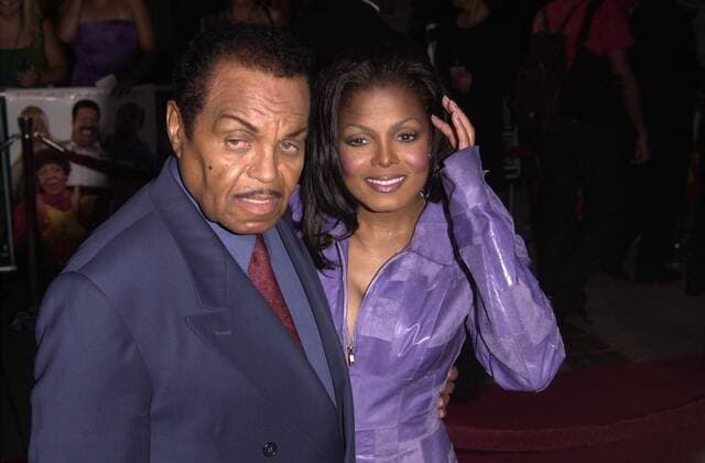 Joe Jackson and Janet Jackson at the premiere of Nutty Professor II in Universal City. 07-24-00 , 10544602.jpg, couple, blazer, mustache, brunette, earring, star, event, people, celebrity,