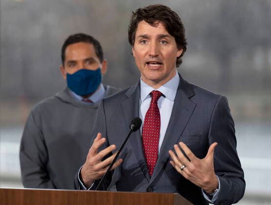 April 21, 2022, Ottawa, ON, Canada: President of the Inuit Tapiriit Kanatami Natan Obed looks on as Canadian Prime Minister Justin Trudeau responds to a question during a news conference, Thursday, April 21, 2022 in Ottawa. Ottawa Canada  - ZUMAc35_ 20220421_zaf_c35_027 Copyright: xAdrianxWyldx