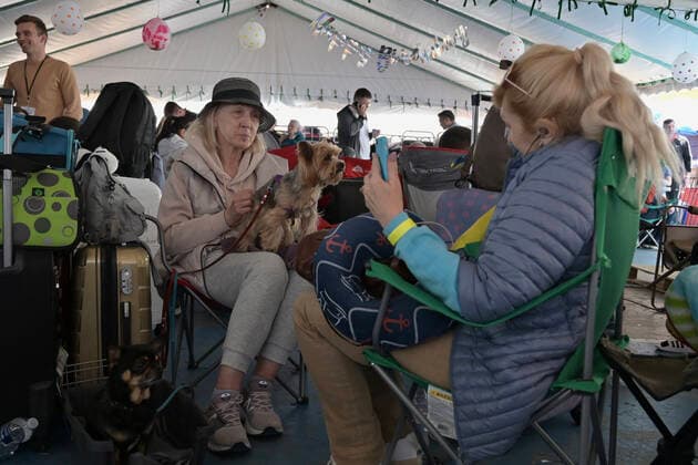 April 21, 2022, Tijuana, Baja California, Mexico: Ukrainian refugees waiting for their turn to get bused for processing to enter the U.S. at the Benito Juarez Sports Complex in Tijuana, Mexico on Thursday, April 21, 2022. ..The Biden Administration announced today that the United States will no longer accept Ukrainian refugees who arrive at the U.S.-Mexico border to seek asylum, instead they will proceeded directly when arriving only via Europe to the States...The move is expected to speed up the processing of applications for Ukrainian refugees and others fleeing war, but it will no longer routinely grant entry to anyone who shows up at the border which thousands have done so previously since the Russian invasion of Ukraine on February 24. - ZUMAm180 20220421_zip_m180_001 Copyright: xCarlosxA.xMorenox