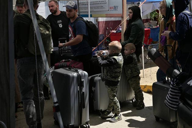 April 21, 2022, Tijuana, Baja California, Mexico: Ukrainian refugees waiting for their turn to get bused for processing to enter the U.S. at the Benito Juarez Sports Complex in Tijuana, Mexico on Thursday, April 21, 2022. ..The Biden Administration announced today that the United States will no longer accept Ukrainian refugees who arrive at the U.S.-Mexico border to seek asylum, instead they will proceeded directly when arriving only via Europe to the States...The move is expected to speed up the processing of applications for Ukrainian refugees and others fleeing war, but it will no longer routinely grant entry to anyone who shows up at the border which thousands have done so previously since the Russian invasion of Ukraine on February 24. - ZUMAm180 20220421_zip_m180_002 Copyright: xCarlosxA.xMorenox