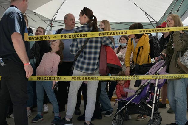 April 21, 2022, Tijuana, Baja California, Mexico: Ukrainian refugees waiting for their turn to get bused for processing to enter the U.S. at the Benito Juarez Sports Complex in Tijuana, Mexico on Thursday, April 21, 2022. ..The Biden Administration announced today that the United States will no longer accept Ukrainian refugees who arrive at the U.S.-Mexico border to seek asylum, instead they will proceeded directly when arriving only via Europe to the States...The move is expected to speed up the processing of applications for Ukrainian refugees and others fleeing war, but it will no longer routinely grant entry to anyone who shows up at the border which thousands have done so previously since the Russian invasion of Ukraine on February 24. - ZUMAm180 20220421_zip_m180_010 Copyright: xCarlosxA.xMorenox