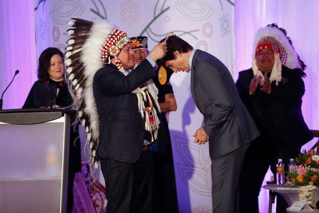 April 22, 2022, WINNIPEG, MANITOBA, CANADA: Southern Chiefs Organization Grand Chief Jerry Daniels gives a gift to Prime Minister Justin Trudeau at a HudsonöÄÃ s Bay Company transfer ceremony in Winnipeg Friday, April 22, 2022. One of the landmark stores formerly run by the HudsonöÄÃ s Bay Company is about to undergo a major transformation in the name of reconciliation with Indigenous people. WINNIPEG CANADA  - ZUMAc35_ 20220422_zaf_c35_028 Copyright: xJohnxWoodsx