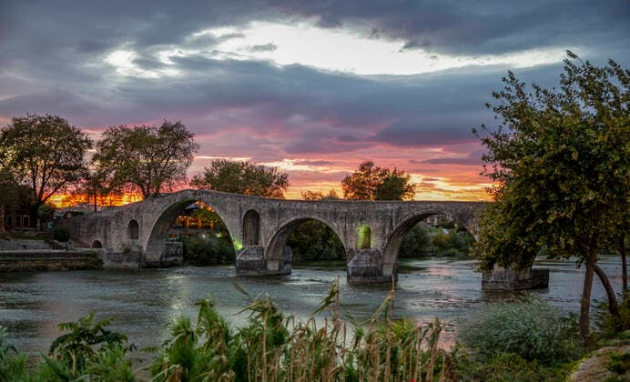 Historic bridge of Arta over Arachthos river on sunset, MAMF02194