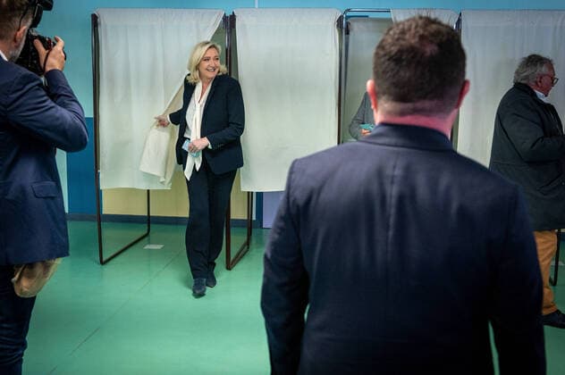 (220424) -- HENIN-BEAUMONT, April 24, 2022 -- Marine Le Pen, the candidate from the far-right National Rally party, casts her ballot at a polling station in Henin-Beaumont, France, April 24, 2022. The 2022 French presidential runoff kicked off at 8 a.m. local time (0600 GMT) on Sunday in Metropolitan France between incumbent President Emmanuel Macron and candidate Marine Le Pen. (Photo by Xinhua) FRANCE-HENIN-BEAUMONT-PRESIDENTIAL ELECTION-SECOND ROUND-VOTE-LE PEN SarahxAlcalay 