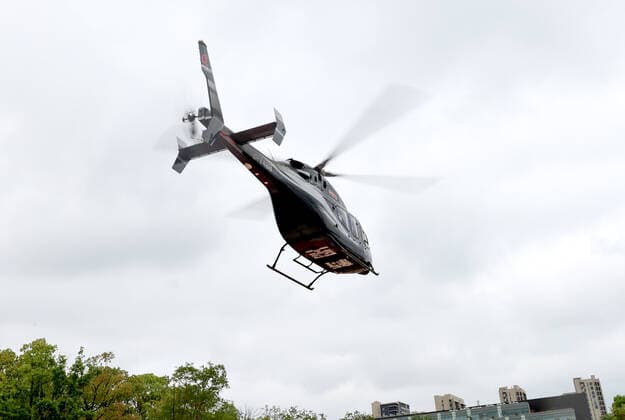 (220424) -- SHANGHAI, April 24, 2022 -- A helicopter takes off from Songjiang District in Shanghai, east China, April 24, 2022. A helicopter company in Shanghai offered free service to transport medical articles to help the city fight against COVID-19. ) CHINA-SHANGHAI-COVID-19-TRANSPORTATION (CN) ChenxJianli 
