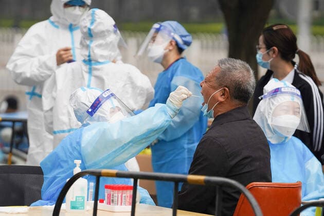(220425) -- BEIJING, April 25, 2022 -- A medical worker takes a swab sample from a resident for nucleic acid test at a testing site in Chaoyang District, Beijing, capital of China, April 25, 2022. Starting from Monday, people who live and work in the Chaoyang District have to take nucleic acid test every two days till April 29 to curb the recent resurgence of COVID-19 here. ) CHINA-BEIJING-COVID-19-NUCLEIC ACID TEST (CN) JuxHuanzong 