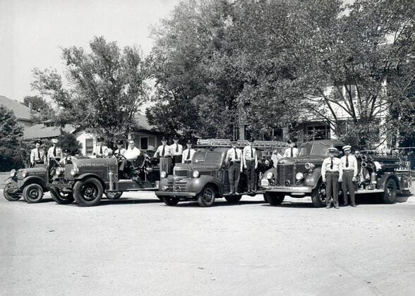 January 1, 2001, San Antonio, Texas, USA: Alamo Heights volunteer firefighters stand around four fire trucks in this undated photo. The volunteers were known to race to the fire station because the first to arrive would drive the truck. The second truck (from left) was built in 1924 by the Buffalo Fire Truck Company. It is now on display at the Texas Transportation Museum. Courtesy photo San Antonio USA  - ZUMAa27_ 20010101_znn_a27_001 Copyright: xSanxAntonioxExpress-Newsx