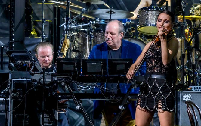 The German Oscar, Grammy and Golden Globe winning composer Hans Zimmer dressed in the colors of Ukraine and his partly Ukrainian orchestra on stage in the Royal Arena on Wednesday 27 April 2022 Hans Zimmer has made music for more than 200 projects, which together have earned close to a staggering 200 billion kr, Copenhagen  Copyright: TorbenxChristensen TorbenxChristensenx COP10686 spdk20220428-010027-L