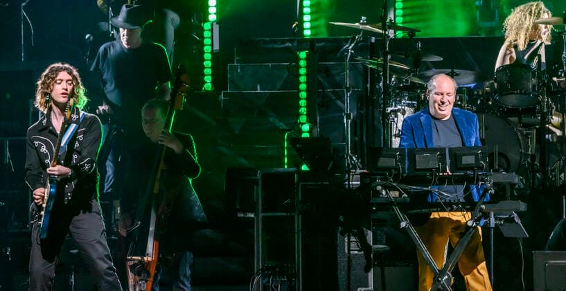The German Oscar, Grammy and Golden Globe winning composer Hans Zimmer dressed in the colors of Ukraine and his partly Ukrainian orchestra on stage in the Royal Arena on Wednesday 27 April 2022 Hans Zimmer has made music for more than 200 projects, which together have earned close to a staggering 200 billion kr, Copenhagen  Copyright: TorbenxChristensen TorbenxChristensenx COP10686 spdk20220428-010039-L
