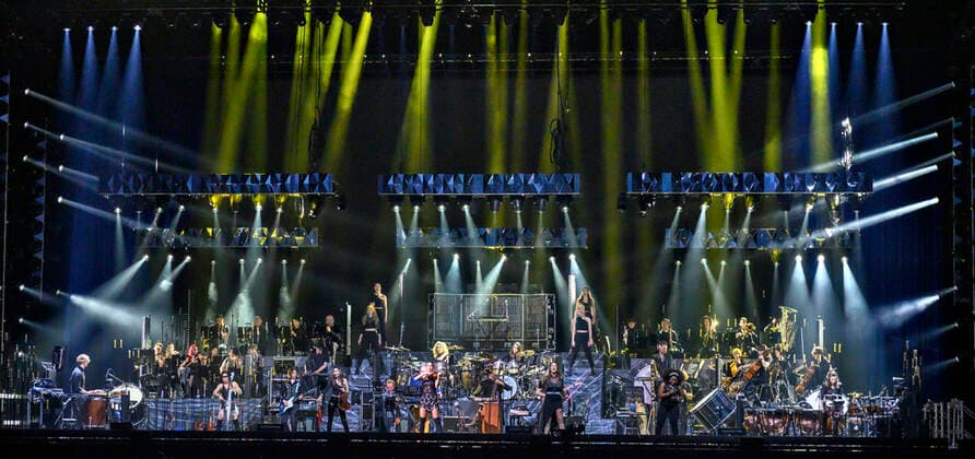 The German Oscar, Grammy and Golden Globe winning composer Hans Zimmer dressed in the colors of Ukraine and his partly Ukrainian orchestra on stage in the Royal Arena on Wednesday 27 April 2022 Hans Zimmer has made music for more than 200 projects, which together have earned close to a staggering 200 billion kr, Copenhagen  Copyright: TorbenxChristensen TorbenxChristensenx COP10686 spdk20220428-010103-L