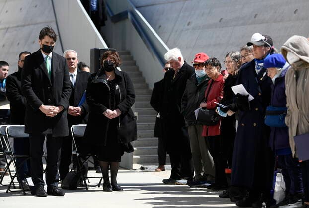 April 28, 2022, Ottawa, ON, CAN: Prime Minister Justin Trudeau and 2nd generation survivor Annette Wildgoose stand with Holocaust survivors and family members, right, during a Yom HaShoah commemoration at the National Holocaust Monument in Ottawa, on Thursday, April 28, 2022. Yom HaShoah is the Jewish community s most significant day for Holocaust remembrance. Ottawa CAN  - ZUMAc35_ 20220428_zaf_c35_038 Copyright: xJustinxTangx