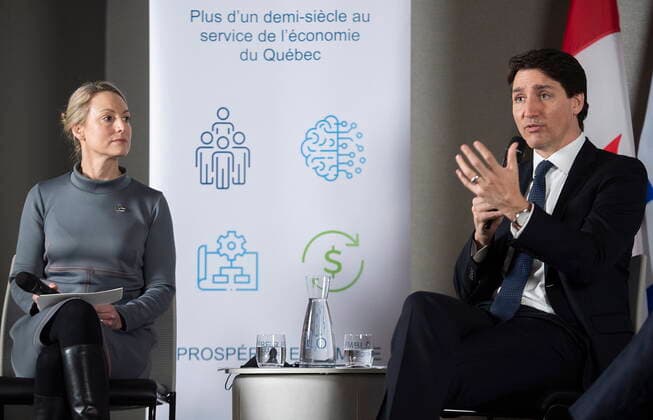 April 29, 2022, Montreal, PQ, Canada: Prime Minister Justin Trudeau addresses members of the Conseil du patronat du Quebec as CPQ President of the Board of Directors Emilie Dussault looks on in Montreal, Friday, April 29, 2022. Montreal Canada  - ZUMAc35_ 20220429_zaf_c35_050 Copyright: xGrahamxHughesx