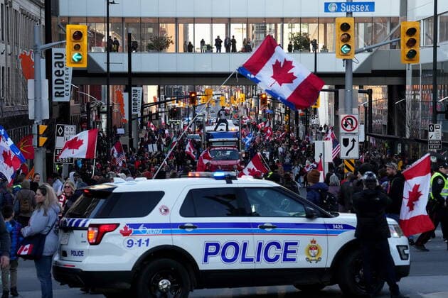 April 29, 2022, Ottawa, ON, CANADA: Police block the road with a cruiser as protesters gather during a demonstration, part of a convoy-style protest participants are calling Rolling Thunder , in Ottawa, Friday, April 29, 2022. Ottawa CANADA  - ZUMAc35_ 20220429_zaf_c35_111 Copyright: xSeanxKilpatrickx