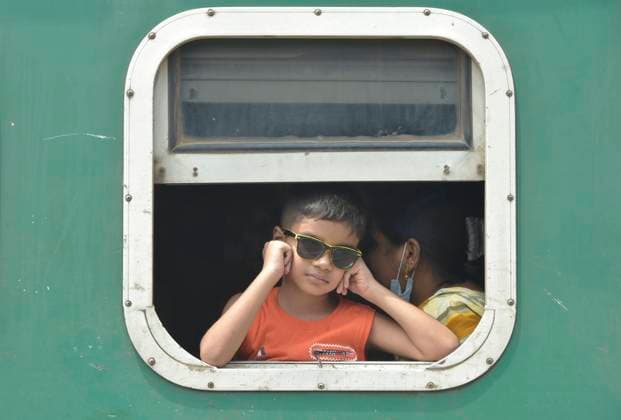(220430) -- DHAKA, April 30, 2022 -- Photo taken on April 29, 2022 shows a child on a train in Dhaka, Bangladesh. As Eid al-Fitr approaches, hundreds of thousands of Dhaka dwellers have streamed out of the city to join the festival with their kith and kin in village homes. BANGLADESH-DHAKA-EID AL-FITR-HOME Salim 