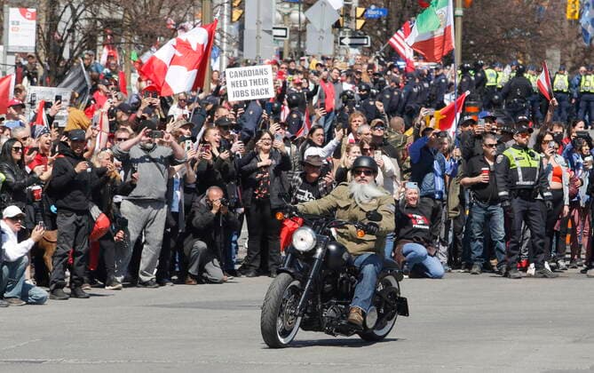 April 30, 2022, Ottawa, ON, Canada: A protester on a motorcycle rides near the National War Memorial, part of a convoy-style protest participants are calling Rolling Thunder , in Ottawa, on Saturday, April 30, 2022. Ottawa Canada  - ZUMAc35_ 20220430_zaf_c35_039 Copyright: xPatrickxDoylex