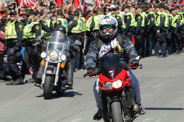 April 30, 2022, Ottawa, ON, Canada: A person on a motorcycle rides near the National War Memorial, part of a convoy-style protest participants are calling Rolling Thunder , in Ottawa, on Saturday, April 30, 2022. Ottawa Canada  - ZUMAc35_ 20220430_zaf_c35_041 Copyright: xPatrickxDoylex