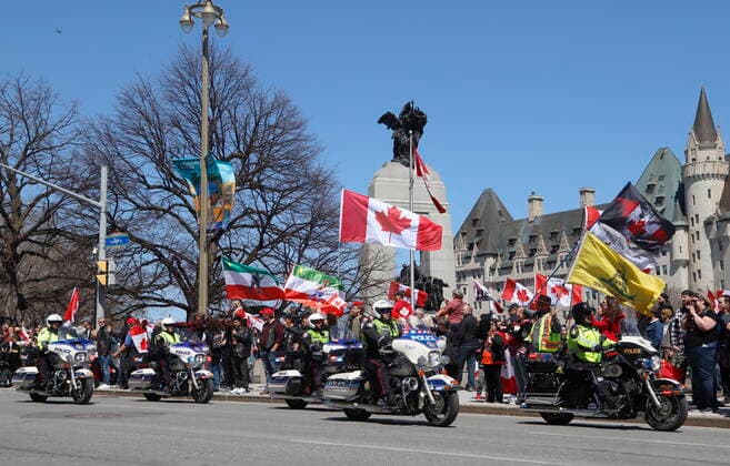 April 30, 2022, Ottawa, ON, Canada: Police on motorcycles ride past a demonstration, part of a convoy-style protest participants are calling Rolling Thunder , in Ottawa, on Saturday, April 30, 2022. Ottawa Canada  - ZUMAc35_ 20220430_zaf_c35_047 Copyright: xPatrickxDoylex