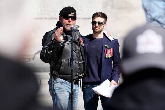 April 30, 2022, Ottawa, ON, CANADA: Neil Sheard, left, an organizer embraces Chris Deering, a guest speaker, as he speaks to protesters during a demonstration, part of a convoy-style protest participants are calling Rolling Thunder , in Ottawa, Saturday, April 30, 2022. Ottawa CANADA  - ZUMAc35_ 20220430_zaf_c35_049 Copyright: xSeanxKilpatrickx