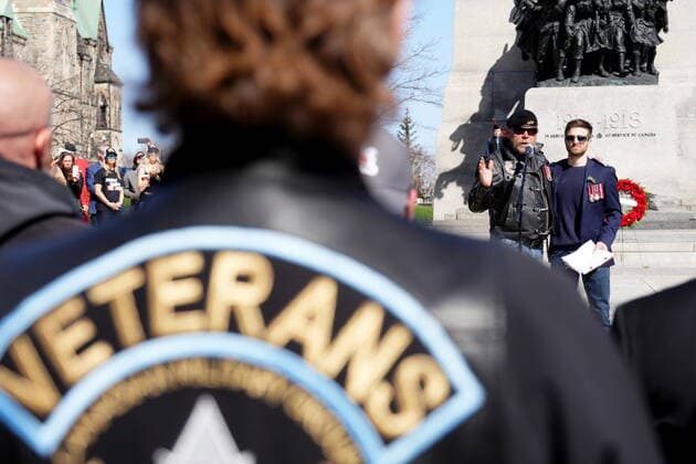 April 30, 2022, Ottawa, ON, CANADA: Neil Sheard, left, an organizer embraces Chris Deering, a guest speaker, as he speaks to protesters during a demonstration, part of a convoy-style protest participants are calling Rolling Thunder , in Ottawa, Saturday, April 30, 2022. Ottawa CANADA  - ZUMAc35_ 20220430_zaf_c35_050 Copyright: xSeanxKilpatrickx