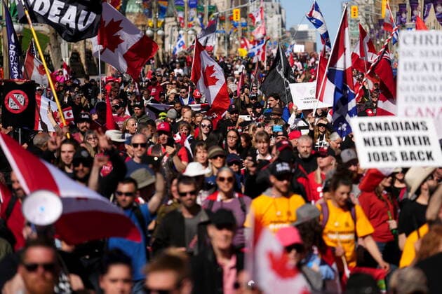 April 30, 2022, Ottawa, ON, CANADA: Protesters gather and wave flags during a demonstration, part of a convoy-style protest participants are calling Rolling Thunder , in Ottawa, Saturday, April 30, 2022. Ottawa CANADA  - ZUMAc35_ 20220430_zaf_c35_124 Copyright: xSeanxKilpatrickx