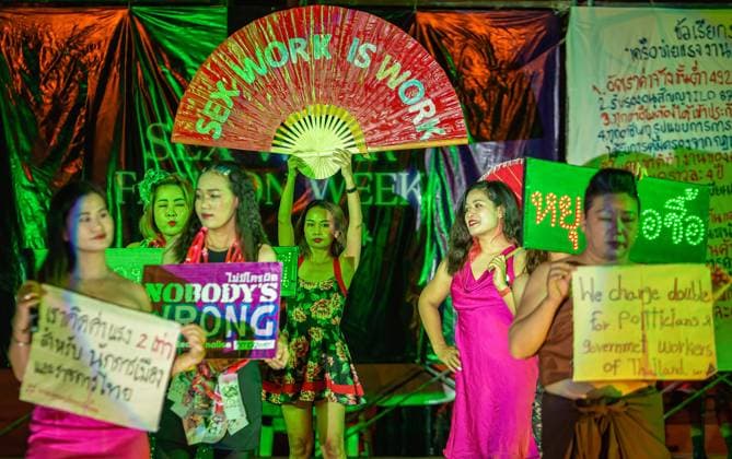May 1, 2022, Chiang Mai, Thailand: Sex workers hold placards expressing their opinion during a Sex Work Fashion Week on International Labor Day at the Tha Phae Gate. Thai and foreigner human rights activists held a fashion show by sex workers first time in Thailand on International Labor Day for furtherance sex service work as legitimate work. Chiang Mai Thailand - ZUMAs197 20220501_zaa_s197_608 Copyright: xPongmanatxTasirix