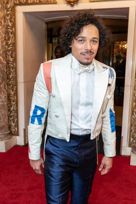 NY: Met Gala 2022 departures from The Pierre hotel Anthony Ramos wearing dress by Tommy Hilfiger departs The Pierre Hotel for the 2022 Met Gala on a theme In America: An Anthology of Fashion with dress code calls for gilded glamour New York New York United States Copyright: LevxRadin