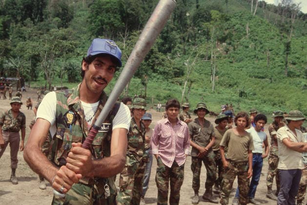 August 17, 1988, Nicaragua: Soldiers swings a baseball bat in the jungle. The Contra War, which was waged between the FSLN-led government of Nicaragua and the United StatesÐbacked Contras from 1981 to 1990. The revolution marked a significant period in the history of Nicaragua and revealed the country as one of the major proxy war battlegrounds of the Cold War, attracting much international attention. Peace process started with Sapoa Accords in 1988 and the Contra War ended after the signing of the Tela Accord in 1989 and the demobilization of the FSLN and Contra armies. Nicaragua Nicaragua - ZUMAm62_ 19880817_jtc_m62_041 Copyright: xKevinxMcKiernanx