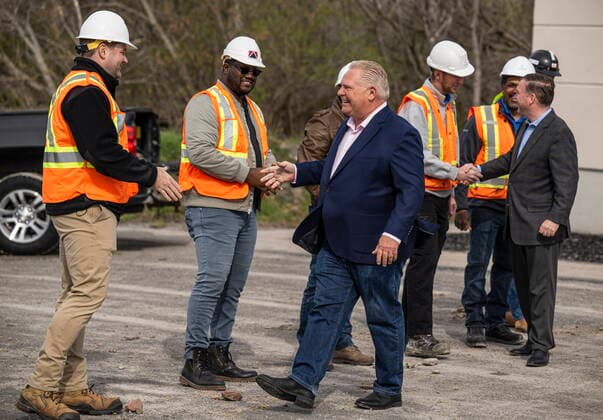 May 6, 2022, Bowmanville, ON, CANADA: Ontario Premier Doug Ford shakes hands with construction workers before making an announcement about building transit and highways, during an election campaign event in Bowmanville, Ont., Friday, May 6, 2022. Bowmanville CANADA  - ZUMAc35_ 20220506_zaf_c35_065 Copyright: xAaronxVincentxElkaimx