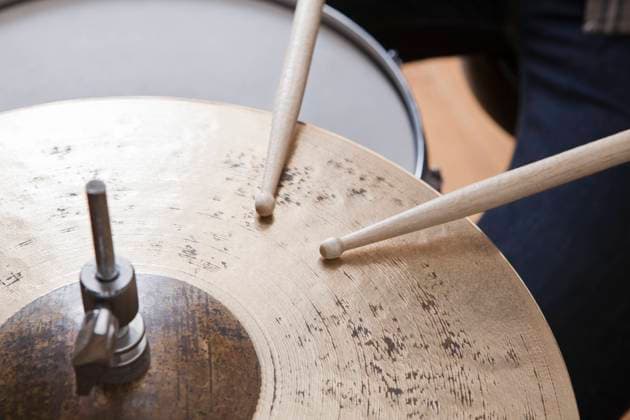 Drumsticks on metal cymbal, model released, , property released, , 10116194.jpg, Day,Indoors,Music,pastime,leisure activity,one person,Musician,Creativity,Metal,inside,playing an instrument,close up,Hobby,Drumstick,Rhythm,beat,cymbal,one man, London