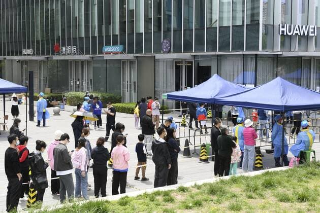 COVID-19 fears in Beijing People form a line to take PCR tests in Beijing on May 9, 2022, amid growing fears of COVID-19 cases.  A14AA0001288008P