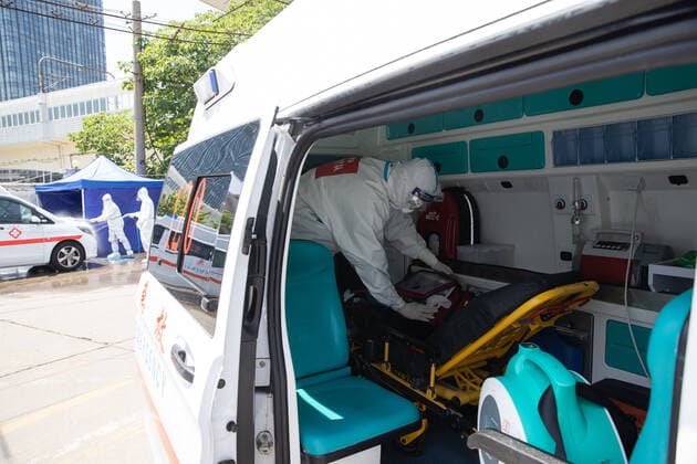 (220510) -- SHANGHAI, May 10, 2022 -- Meng Xiangjun disinfects an ambulance near the headquarters of a medical emergency team in east China s Shanghai, May 9, 2022. A medical emergency team consisting of 108 members with 50 ambulances from north China s Tianjin has arrived at Shanghai to assist in the city s public medical emergency service amid the COVID-19 resurgence. ) CHINA-SHANGHAI-MEDICAL TEAM-COVID-19-AID (CN) JinxLiwang 
