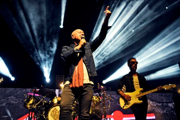Singer Jim Kerr and bassist Ged Grimes Simple Minds at a concert of the Celebrating 40 Years of Hits tour at the Halle Münsterland in Münster snapshot photography D Vorndran
