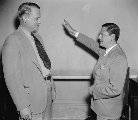 Heil Hitler salute given to the chairman of United States Special House Committee Called as the first witness before the Special House Committee investigating Un-American activities, John Metcalfe, former Chicago reporter but now an investigator for the committee, gives Chairman Martin Dies (right) a Nazi salute before taking the stand. Joining under the name of Helmut Oberwinder, Metcalfe related his experiences as a member of the German-American bund and charged the organization has a secret relationship with the Nazi government in Germany Copyright: xPhoto12 AnnxRonanxPicturexLibraryx ARP18A07_367