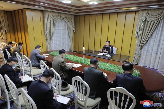 (220513) -- PYONGYANG, May 13, 2022 -- Photo provided by Korean Central News Agency () on May 13, 2022 shows Kim Jong Un, top leader of the Democratic People s Republic of Korea (DPRK), visiting the state emergency epidemic prevention headquarters on May 12, 2022. Kim Jong Un on Thursday called for quick action to contain the spread of COVID-19, when visiting the state emergency epidemic prevention headquarters, the official reported. ( via Xinhua) DPRK-COVID-19-KIM JONG UN-QUICK ACTION KCNA 
