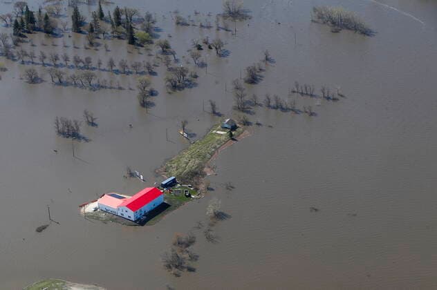 May 15, 2022, WINNIPEG, MB, CANADA: Some properties along Highway 75 are isolated due to Red River flooding south of Winnipeg, Sunday, May 15, 2022. Some sections of the highway are closed south to the United States. WINNIPEG CANADA  - ZUMAc35_ 20220515_zaf_c35_063 Copyright: xJohnxWoodsx