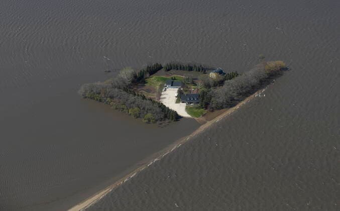 May 15, 2022, WINNIPEG, MB, CANADA: Properties near Emerson, Man., are isolated as a result of the Red River overflowing its banks south of Winnipeg, Sunday, May 15, 2022. WINNIPEG CANADA  - ZUMAc35_ 20220515_zaf_c35_080 Copyright: xJohnxWoodsx