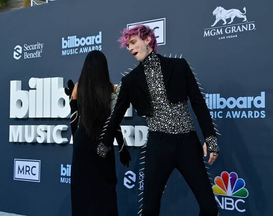 Megan Fox and Machine Gun Kelly attend the annual Billboard Music Awards held at the MGM Grand Garden Arena in Las Vegas, Nevada on May 15, 2022.  LAV202205150503 JIMxRUYMEN