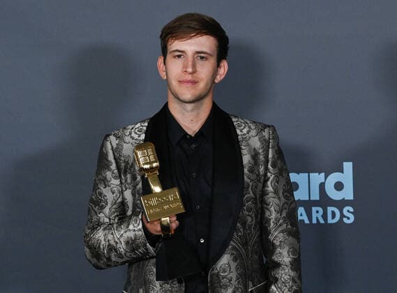 Illenium appears backstage with his award during the annual Billboard Music Awards held at the MGM Grand Garden Arena in Las Vegas on May 15, 2022. The musician was honored with Top Dance Electronic Album for Fallen Embers .  LAV202205150614 JIMxRUYMEN