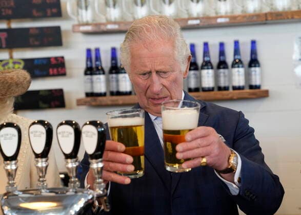 May 17, 2022, St. John s, NL, Canada: Prince Charles compares pours of beer at the Quidi Vidi Brewery, located in a fishing village in the east end of St. John™s, during their Canadian Royal tour, Tuesday, May 17, 2022. St. John s Canada  - ZUMAc35_ 20220517_zaf_c35_200 Copyright: xPaulxChiassonx