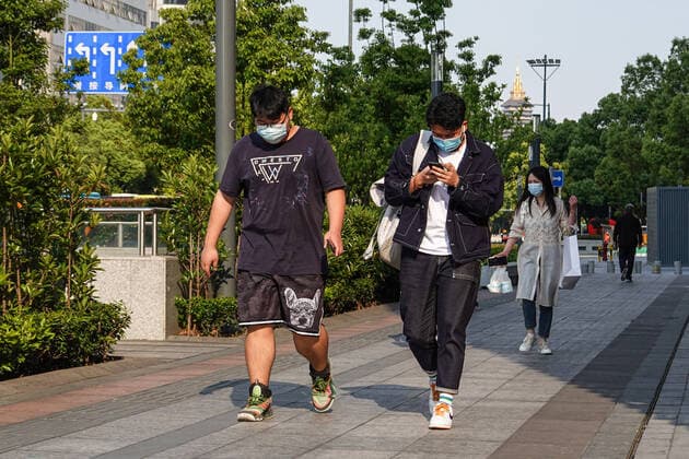 May 17, 2022, Changzhou, China: People wearing face masks as a preventive measure against the spread of coronavirus walk down the road. According to China s economy is supposed to see improvement this month despite weak business data in April, and economic activities may rebound with a gradual recovery in household spending and strong fixed-investment support in the following months, officials and experts said on Monday. They said China s economy should gradually stabilize and recover, with improvement in some key economic indicators, better containment of COVID-19 outbreaks, and stronger policy support. Changzhou China - ZUMAs197 20220517_zaa_s197_392 Copyright: xSheldonxCooperx