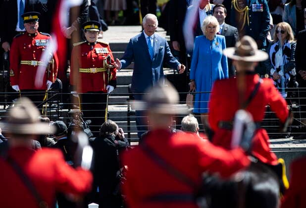 May 18, 2022, Ottawa, ON, Canada: Prince Charles motions for the performance of the RCMP Musical Ride to begin, as he attends with Camilla, Duchess of Cornwall and RCMP Commissioner Brenda Lucki, second from left, in Ottawa, during their Canadian Royal tour, on Wednesday, May 18, 2022. Ottawa Canada - ZUMAc35_ 20220518_zaf_c35_111 Copyright: xJustinxTangx