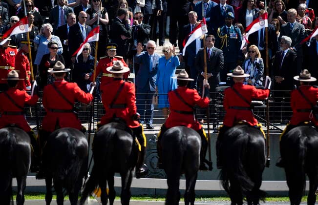 May 18, 2022, Ottawa, ON, Canada: Prince Charles and Camilla, Duchess of Cornwall wave after a performance of the RCMP Musical Ride in Ottawa, during their Canadian Royal tour, on Wednesday, May 18, 2022. Ottawa Canada  - ZUMAc35_ 20220518_zaf_c35_110 Copyright: xJustinxTangx