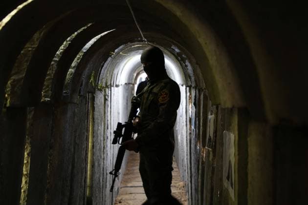 May 18, 2022, Beit Hanoun, Gaza Strip, Palestinian Territory: A member of Saraya al-Quds, the military wing of the Islamic Jihad movement takes a position inside a military tunnel marking the first anniversary of conflict between Hamas and Israel on May 2021, in Beit Hanoun in the northern Gaza Strip. In a tunnel city under the sandy soils of southern Gaza, Palestinian militants are preparing for the next conflict with Israel, as tensions in Jerusalem threaten to escalate. Beit Hanoun Palestinian Territory - ZUMAap3_ 20220518_zaf_ap3_152 Copyright: xDawoudxAboxAlkasx
