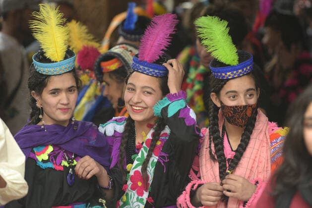 Pakistan: Chilmjushi Festival in the Kalsh Valley Kalashi women and men wearing traditional dresses participating in the dance during the Chilmjushi Festival in the Kalsh Valley. Chilum Joshi is also known as a Kalash spring festivals. Dressed up in newly knitted clothes with elaborate headgear and jewelry in vibrant colors , Kalasha women dance to traditional drumbeats during the chilum joshi festivals that concluded here at the scenic Bamburet valley on Sunday with fanfare. The four days event attracted an unprecedented number of tourists including a group of 22 Malaysian motorcyclists, besides the French, Australian and Italian nationals, on the concluding day of the festival young men women select their life partners while each day f Copyright: RanaxSajidxHussain