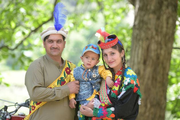 Pakistan: Chilmjushi Festival in the Kalsh Valley Kalashi women and men wearing traditional dresses participating in the dance during the Chilmjushi Festival in the Kalsh Valley. Chilum Joshi is also known as a Kalash spring festivals. Dressed up in newly knitted clothes with elaborate headgear and jewelry in vibrant colors , Kalasha women dance to traditional drumbeats during the chilum joshi festivals that concluded here at the scenic Bamburet valley on Sunday with fanfare. The four days event attracted an unprecedented number of tourists including a group of 22 Malaysian motorcyclists, besides the French, Australian and Italian nationals, on the concluding day of the festival young men women select their life partners while each day f Copyright: RanaxSajidxHussain
